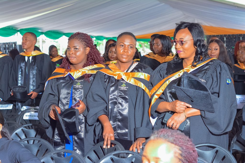 WUA graduates seated together at a graduation ceremony.